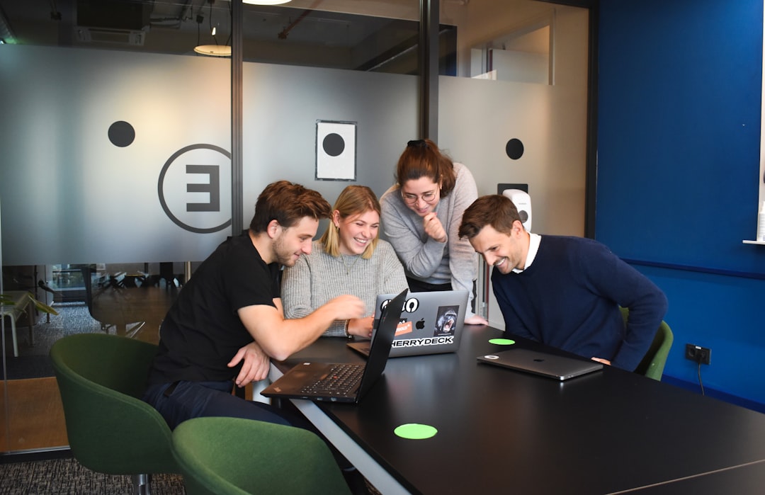 digital product launch - people sitting on chair in front of laptop computers