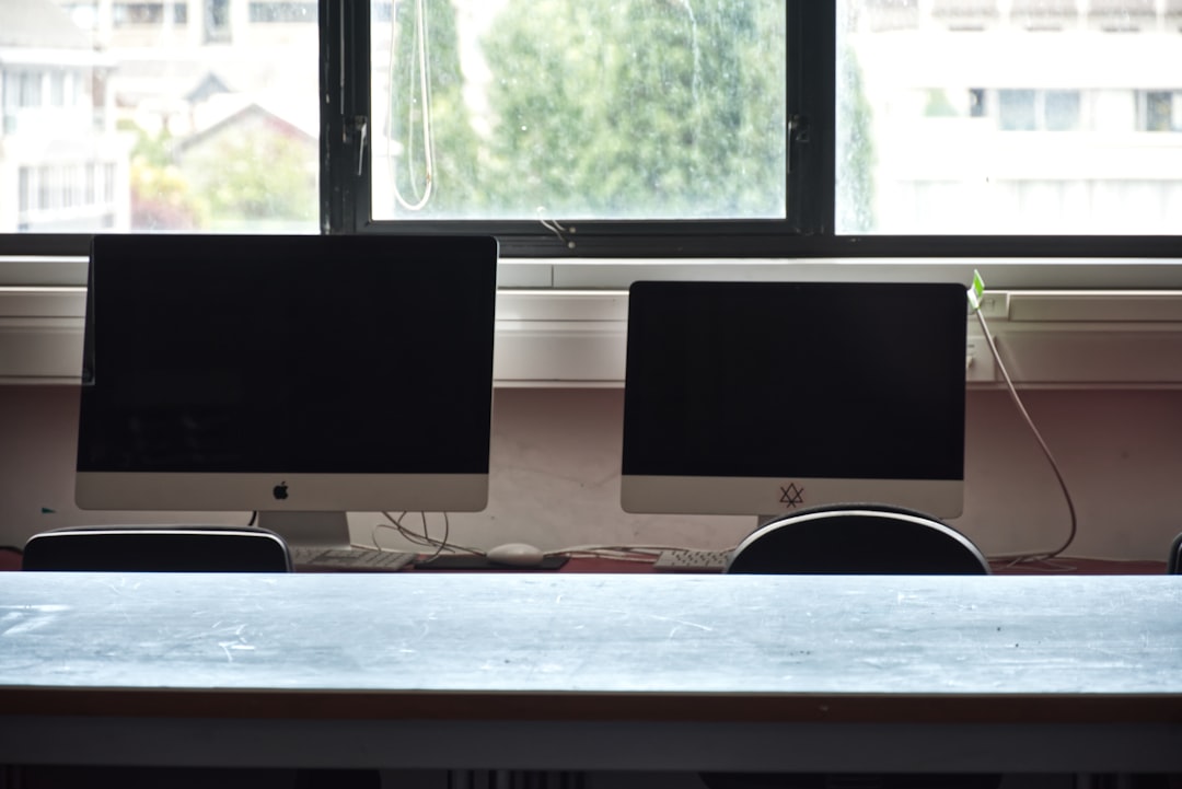 digital transformation small business - Two computer monitors on a desk
