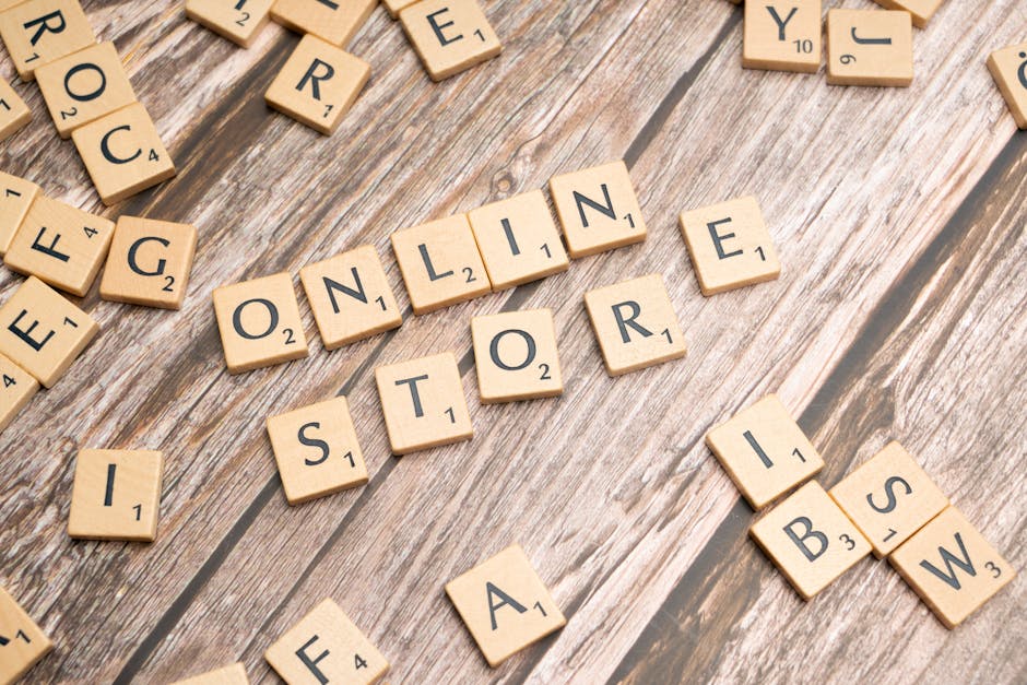 Shopify vs WooCommerce - Scrabble tiles spelling 'online store' on a rustic wooden background.