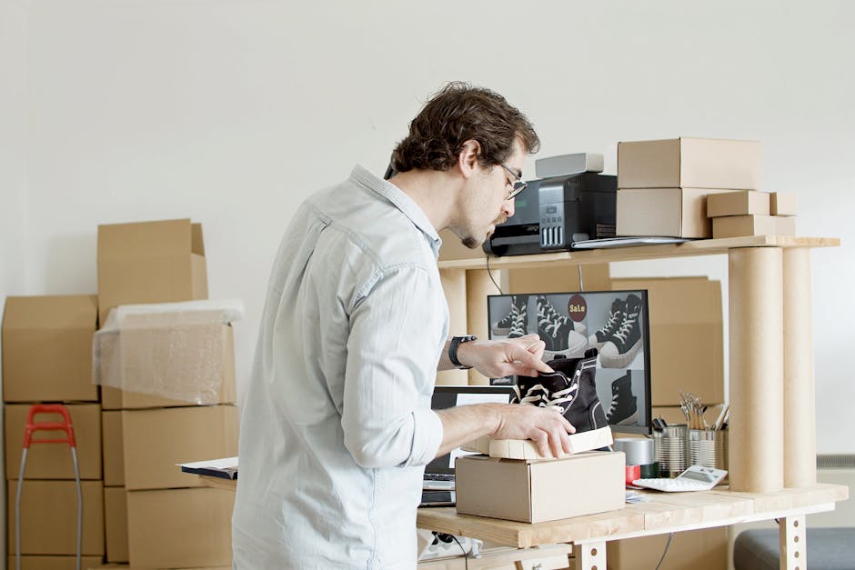 Shopify vs WooCommerce - A businessman working in an online store packing shoes in a cardboard box.