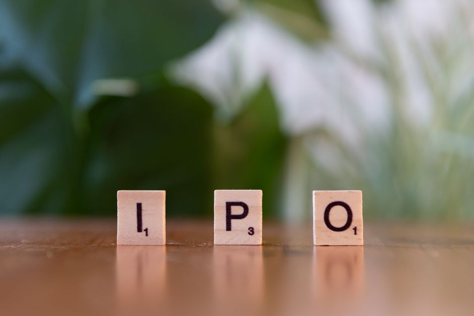 AI startup news - Wooden letter blocks spelling IPO on a table, symbolizing investment opportunities.